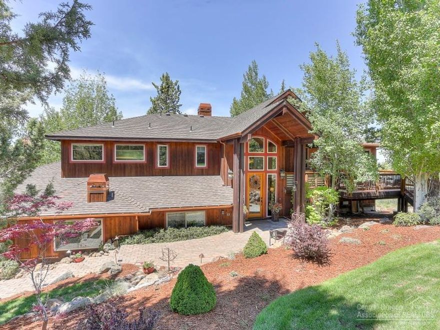 Stunning Cascade Mt views from this beautiful, meticulously maintained home atop Awbrey Butte. The spacious floor plan features rich wood floors, exposed beams, rock fireplace, and gourmet kitchen. Choose outdoor living from an intimate east-facing deck with covered outdoor kitchen or large cedar decks on the NW side overlooking a tranquil water feature to Million Dollar views. This outstanding home resides on a quiet street and is beautifully landscaped with paver walkways and heated paver driveway.