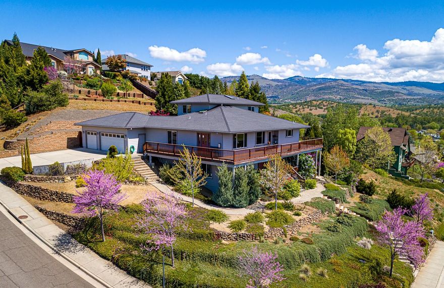 Gorgeous 3309 square foot home with breathtaking views! This 4 bedroom, 4 bath home is perfect for entertaining with a living room, family room and bonus room! The large kitchen features a subzero refrigerator, stainless steel appliances, double oven and walk-in pantry. The master includes a walk-in closet and ensuite bathroom with a jetted soaking tub & separate tiled shower. Enjoy the sunsets from the wrap-around deck, overlooking the terraced yard and the amazing views. Or relax by the Koi pond listening to the sounds of the relaxing waterfall. This move-in ready home is a must see!