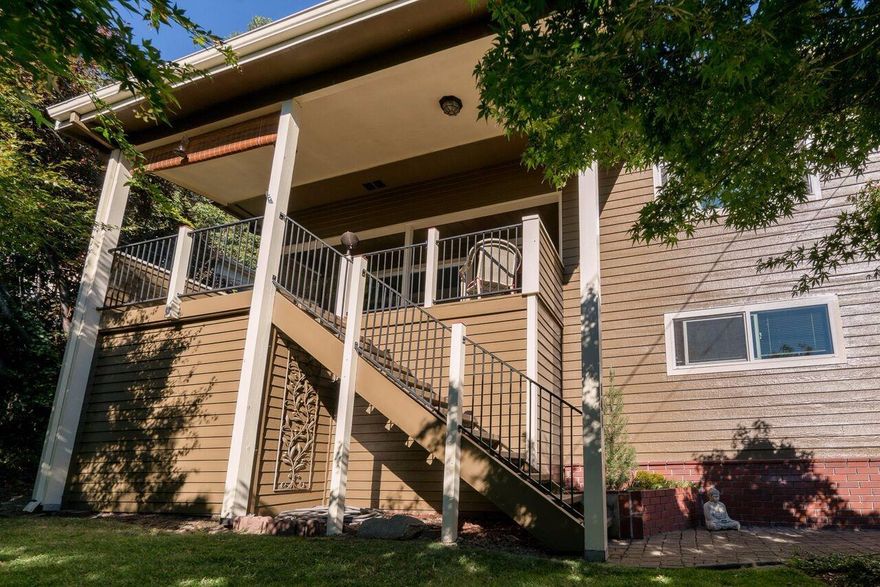 This San Francisco style craftsman home located in East Medford features 3 bedrooms and 2 bathrooms and has a bonus room that could be converted back into a 4th bedroom (its currently being used as a multiple family set-up). As you approach this home you will see a variety of flora landscaped for simple beauty with ancient Japanese maples and dozens of flowering perennials. Elevated above other homes in this neighborhood you can see mountains, city lights and relax while watching the sun fade from the front deck. Entering this home you will find a vaulted beamed living room that is breath taking - gorgeous oak hardwood floors and unique architectural features. Natural light flows within as well as many unique lighting features throughout this home. The kitchen features a huge granite island with abundant counter space and an beautiful tongue and groove cedar ceiling with recessed lighting. Stainless appliances and a under mount sink are both upgrades. An elegant vaulted dinin