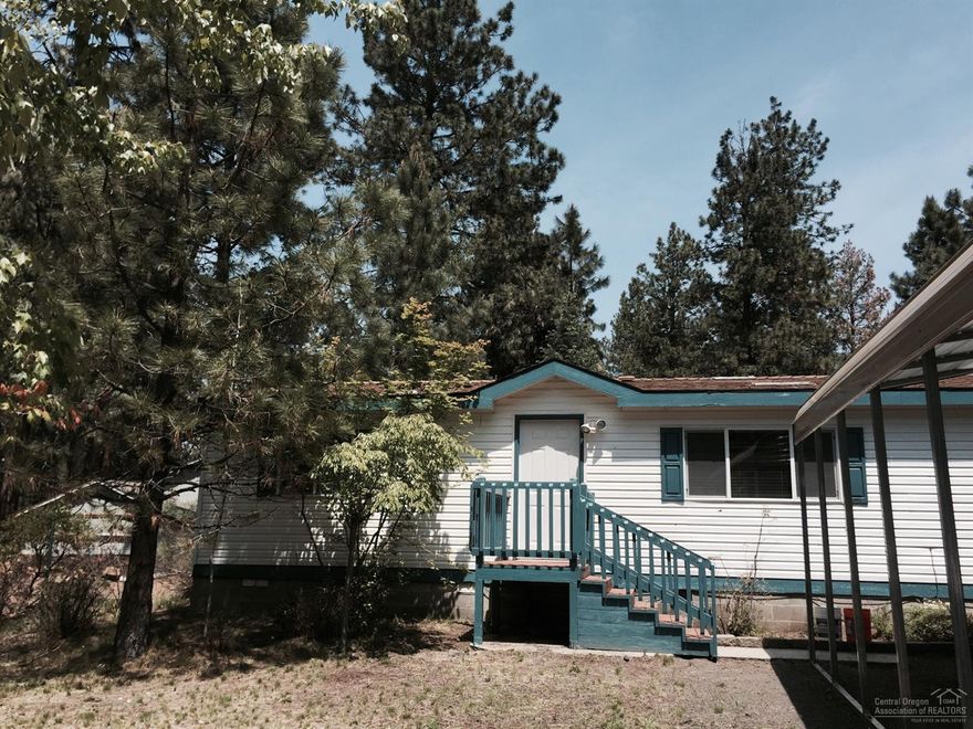 Located on the canal on a large lot in a nice neighborhood. New carpeting throughout, new kitchen cabinets and flooring, new interior paint, new interior doors, and a new back deck. Enjoy the back yard with outbuildings for storage. Landscaped with sprinklers surrounding a nice home. Clean and move in ready. Don't miss this one!