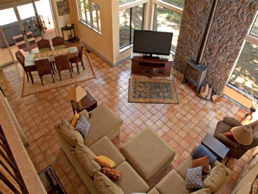 Custom built home in 'Park Avenue' location just a stone's throw from the Deschutes River.Dramatic living area with soaring two story vaulted beamed ceiling.Elegant Master Suite on first floor with slab granite and alder cabinetry in master bath. Upstairs: large second bedroom and two adorable 'kids' bedrooms, and loft area overlooking the first floor and the floor to ceiling windows. 2 full baths/2 half baths. Enjoy outdoor living on the deck with majestic and highly prized Ponderosas.