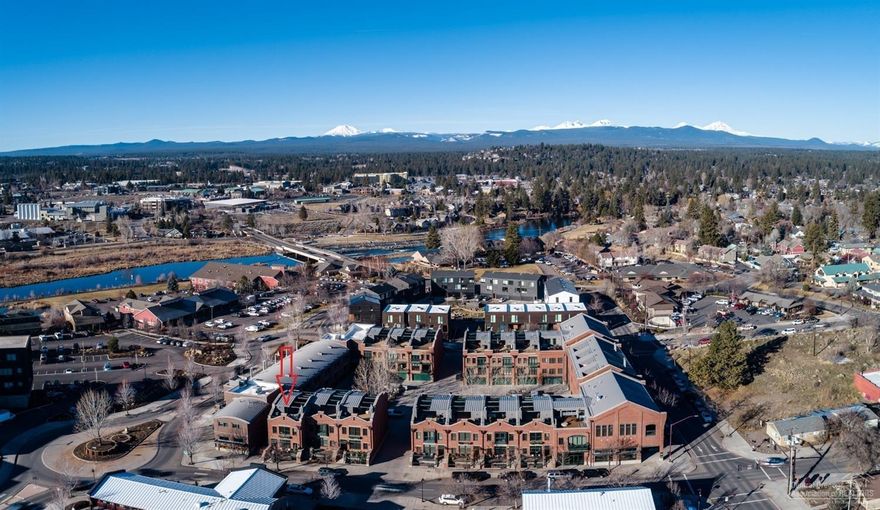 Northwest Modem Interior accents & industrial architectural design complement this newly renovated Mill Quarter Townhome. The Interior layout is perfect for small group entertaining, with intimate seating areas, a gas fireplace, and built-in bar area. The modern interior features dramatic ceilings, exposed ductwork, a new gourmet kitchen w/commercial Subzero & Wolf appliances. hardwood and concrete floors, private elevator, 3 En Suites and an expansive private rooftopdeck. Relax under the stars complete with Hot Tub & Mountain views! With a full complement ofamenities this Brownstone offers four seasons of alfresco luxury for you and your guests. Located in the heart of Bend in the Old Mill District near Downtown. And no HOA fees!