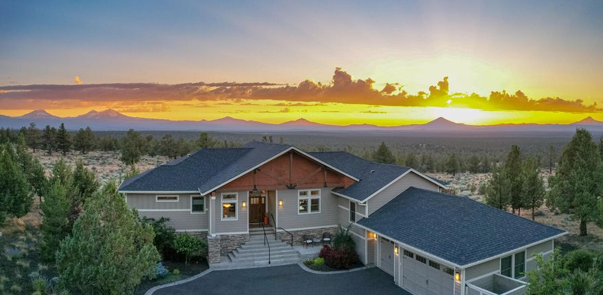 Enjoy the very best of Eagle Crest Resort! Beautifully furnished custom home located in the private gated community of Scenic Ridge with panoramic views of the Cascade Mountains. One of eight lots in this coveted neighborhood, the property backs to BLM and is approved for a 1200 sq ft casita. The open-concept floor plan boasts hickory hardwood floors, a vaulted wood ceiling, a stacked stone gas fireplace, and a built-in entertainment center. The kitchen features a spacious dining area, slab granite countertops, an island with a breakfast bar, a gas cooktop, stainless appliances, a walk-in pantry, and a wet bar. Two primary suites with double-sink vanities, huge tiled walk-in showers, soaking tubs, walk-in closets, and separate water closets. Two large guest rooms, a family room, an office area, a full bath, a partially finished bonus room, and multiple storage rooms are located on the lower level. Expansive Trex deck with hot tub, lower patio, and a triple car garage.