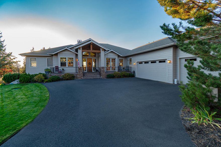 Who says you can't have it all? Perfectly situated on a level lot with breathtaking views of the Cascade Mountains, this gorgeous single-level custom home features an open concept floor plan with spacious rooms, thoughtful design, timeless finishes, and backs to common space, and BLM land. The great room boasts a stacked stone gas fireplace with hearth, dream kitchen with massive island, expansive breakfast bar, a large open dining area, and easy access to the front deck and the covered back Trex Deck. The primary suite features a gas fireplace, double sink vanity, walk-in shower, large soaking tub, walk-in closet, and slider to deck. Two additional guest rooms; one with a private ensuite, and one adjoins a full bath with access to the hallway. Office with built-in bookshelves and closet could be a 4th bedroom. Triple car garage, huge fenced dog run, and large storage area under the home. Located near the Lakeside Sports Center, Trail Creek walking path, and BLM trails.