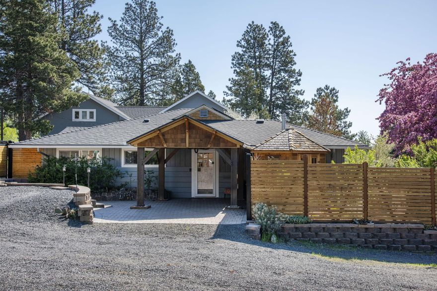 New price plus at $25K credit for buyer! Stunning single level home on .34 acre lot in River West with views overlooking the Old Mill and the Deschutes River is a slice of paradise in the heart of Bend. This fully remodeled, energy efficient home has charm galore with 3 beautiful bedrooms, 3 full baths, plus an office/flex space off the primary suite. Step outside and discover the garden of your dreams with fruit trees, berries, herbs, relaxing decks and patio plus room for an RV with hookup, and space for an ADU. Custom touches and thoughtful design can be seen throughout the home, from solar panels on the roof, custom tile work in the kitchen, quartz counters, spa-like primary bathroom with radiant floors and more. You have to see this home to appreciate all the attention put into it. The location can't be beat-walk to the Deschutes River, First Street Rapids, Hillside Park, Newport Avenue but has the benefit of a quiet dead end street with view