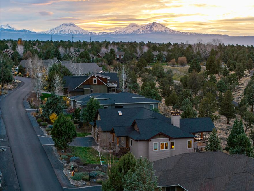Custom-built Eagle Crest retreat, filled with Northwest charm and thoughtful details. Gorgeous millwork, exposed beams, and engineered hardwood floors frame the open great room, centered around a stack-stone wood-burning fireplace with built-ins. The kitchen flows into the dining / living areas and features an eat-in island, quartz counters, custom cabinetry w/ smart built-ins, stainless appliances, and a gas range. A covered deck just off the great room is ideal for year-round entertaining and easterly mountain views. All bedrooms are on the main level for easy living, including a private primary suite with a 5-piece ensuite and generous walk-in closet. Two additional bedrooms, a front office, and a large laundry room complete the main floor. Upstairs, a bonus room adds space for a gym, TV room, or hobbies, while the 3-car garage and storage rooms below offer plenty of room for gear. Lakeside and Ridge sports centers are just a short stroll away via the path below.