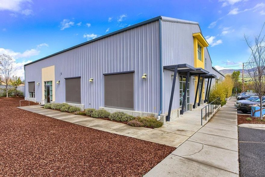 Historic industrial building 3 blocks to Ashland's Plaza, underwent an architectural remodel and design by Jerome White in 2009 and an additional remodel in 2015. Thrive in the heart of Ashland's forward thinking community in a building that continues to evolve to meet the needs of growing and exciting businesses. The appx 43000SF building is largely insulated and heated providing options for your business while enjoying the income from the other rented suites. Offering 2 tax lots totally 1.6 acres. 11 leasable suites: finished office space w/ Helman St. frontage, industrial storage/warehouse, 2 gyms & more. 10 exterior roll up doors, flexible interior offers interior roll up doors, 7 bathrooms, 6 w/handicap access & ample parking. Massive unfinished space w/ private entrance & access to potential elevator allows for an additional 5000SF with completed and approved architectual plans for contemporary office space including large dormer windows with views of Mount Ashland.
