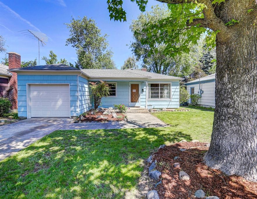 This is an absolute Doll House and the perfect home for a couple or young family. Freshly painted inside and out this beauty shines like a classy, new penny with refinished hardwood floors, cozy fireplace and the garage can easily be converted to additional living space giving you a potential 3 bedroom/1171sf home. The patio is perfect for those summer barbecues. There's a garden area and the yard is private and cute-cute-cute! This lovely cottage won't be around long at this price!