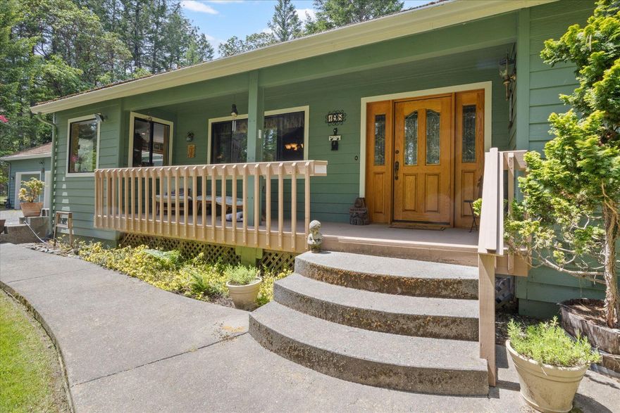 Timeless Southern Oregon Beauty on Usable Acreage - Quality, Comfort & Charm! Quality-built and nestled on a peaceful parcel in Southern Oregon, this 3bd, 2.5ba home blends timeless construction with classic upgrades. Vaulted ceilings, large windows, and warm wood finishes create a welcoming interior, anchored by a cozy woodstove set on brick. Kitchen features solid wood cabinets, tile counters, and a sunny breakfast nook. Spacious primary suite wing w/dual vanities, soaking tub, walk-in closet. Enjoy room to garden, raise animals, or savor the quiet beauty of rural life. Plenty of space for a shop, RV, or boat—no HOA, no hassle. Imagine morning coffee on the porch, evenings under star-filled skies, and the freedom to live how YOU choose. Oversized 800+sf 3car garage, tile roof, 2+acre well-maintained country-luxury estate minutes from Griffin Park & Rogue River - bring your boat! (and room to park it, too.) Schedule your tour today and make this countryside retreat your next chapter!