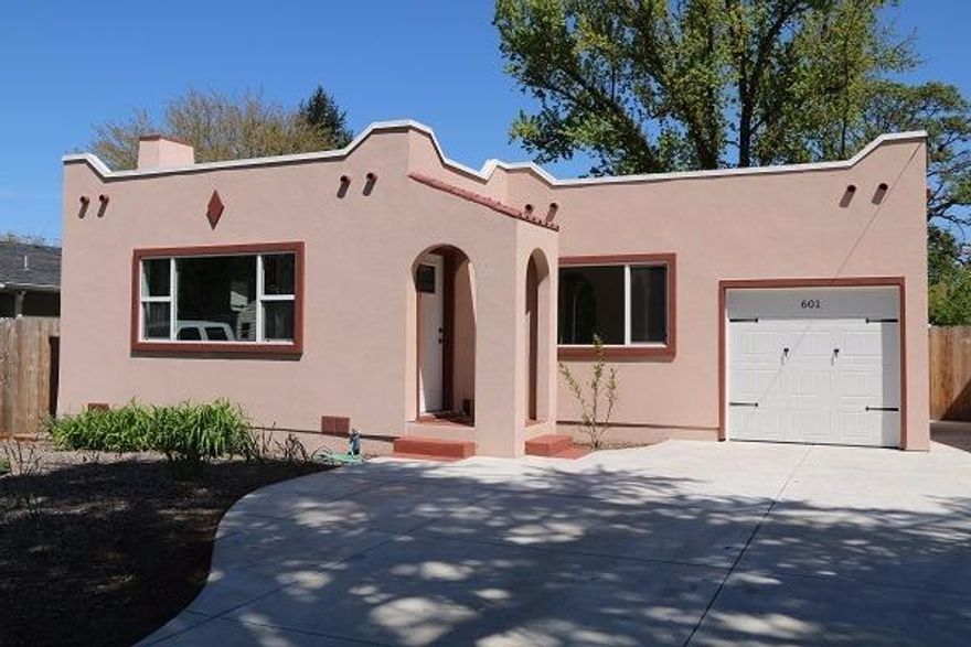 Historic home lovingly restored to better than its former glory! High ceilings, original gleaming hardwood floors, glass door knobs, many built-ins, coffered ceiling, and antiquey tub - all redone and like new but with the unique charm you only find in older homes! New electrical, stucco, windows, roof, insulation, shaker style cabinets, flooring, an energy efficient LED lighting and new gas forced air furnace and central air conditioning! Curl up in front of the fireplace with the new electrical insert and original masonry! Huge utility room and extra storage! Nice attached single car garage, back yard shed, newer xeriscaping in the front yard and mature, large & private back yard with new large concrete patio and drive. Nice area of well-kept historic homes. Don't miss this home offering all the beauty and craftsmanship of 1927 and all the modern amenities you expect.