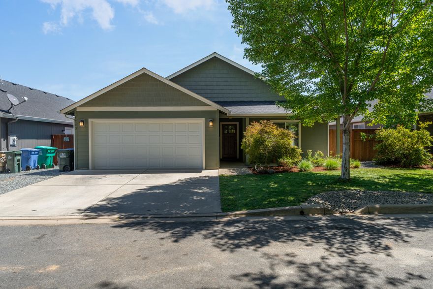 Welcome to this beautiful 2014 Northridge built home in the desired Summerfield Estates! The craftsmanship of this home is shown throughout. Inside you'll find engineered hardwood floors, vaulted ceilings, and a large living area with an open floor plan. The kitchen features natural pine custom cabinetry topped with granite, a walk-in pantry, and breakfast bar. The primary suite features a vaulted ceiling, large walk-in closet, double vanity with granite top, and a fiberglass surround shower with a glass door. The two spare bedrooms share a bathroom in the hall that features a fiberglass tub surround and granite top vanity. The Laundry room is located between the garage and the hall. Outside of the dining room sliding glass door, you'll find a covered patio, landscaping on timed sprinklers and a fenced in backyard. The front yard features mature landscaping on timed sprinklers as well as a covered front porch. This home is located off of a shared private access drive.