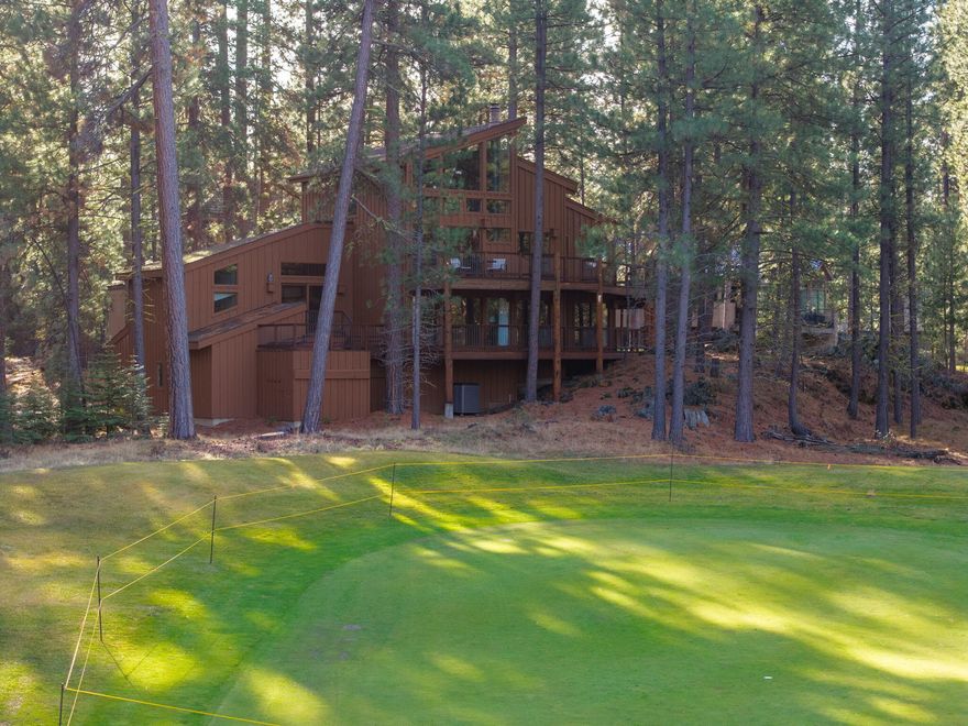 Located on the Big Meadow Golf Course at Black Butte Ranch, this fully furnished, 3,602 sq. ft. home offers elevated views of the 13th green and 14th tee.  Multiple tiered decks provide excellent indoor/outdoor living and entertaining opportunities. After a day of golf or skiing, relax by one of two fireplaces or enjoy the jetted tub in the primary bath.  The upper-level main living area features a spacious kitchen with island, wet bar, breakfast nook, dining area, family room, plus additional loft spaces with a bar and flexible-use areas.  The main level includes 5 bedrooms and 4 bathrooms, each with access to its own private deck.  A 2-car garage with basement provides ample storage for outdoor and winter equipment. This is your chance to live and play at the ranch with access to golf courses, dining, pools, spa, fitness center, sports courts, walking and biking paths, recreation center, and year-round activities.
