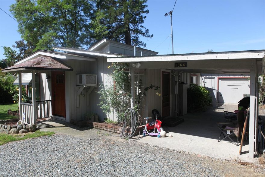 100% financing may be available on this one. Home is significantly larger than it appears from street. A drive by will not do it justice. Granite counter tops and tile floors in the kitchen. Double pane windows throughout. Solar tubes for great light in several rooms. All this on a 1/3 of an acre and near all amenities. New roof on home and shop and garage. New laminate floors. Old hardwood floors underneath.