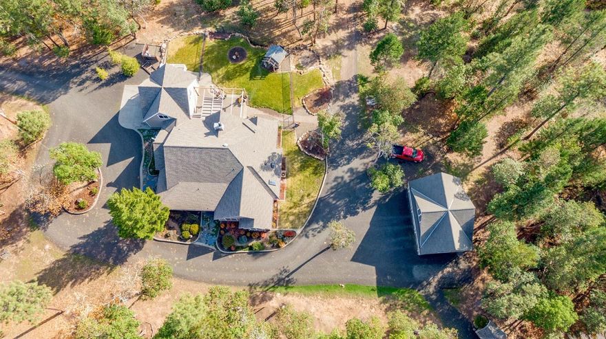 Imagine coming home to this private craftsman style home consisting of 4 bedrooms/ 2.5 bath at a generous 2,541 sf. This home sits on 41.04 acres backed by BLM. With this extremely open floor plan you will see soaring 20ft ceilings complimented w/ many windows throughout giving you an abundance of natural lighting. Granite counter tops in the kitchen as well as tiled flooring in the kitchen & bathrooms, carpeted bedrooms & very well-kept hardwood flooring throughout other living areas. The master bedroom has beautiful tray ceilings, large windows & glass French doors leading you to your relaxing patio allowing you to enjoy the peaceful & wonderful views of Mt. Mcloughlin. The master bath has a large jetted tub, double sink, along w/ an oversized double headed walk in shower. Attached is a two-car garage along with an unattached 3 car garage & finished bonus room above. The yards are beautifully landscaped & equipped with a sprinkler system. This immaculate home is an unusual find!