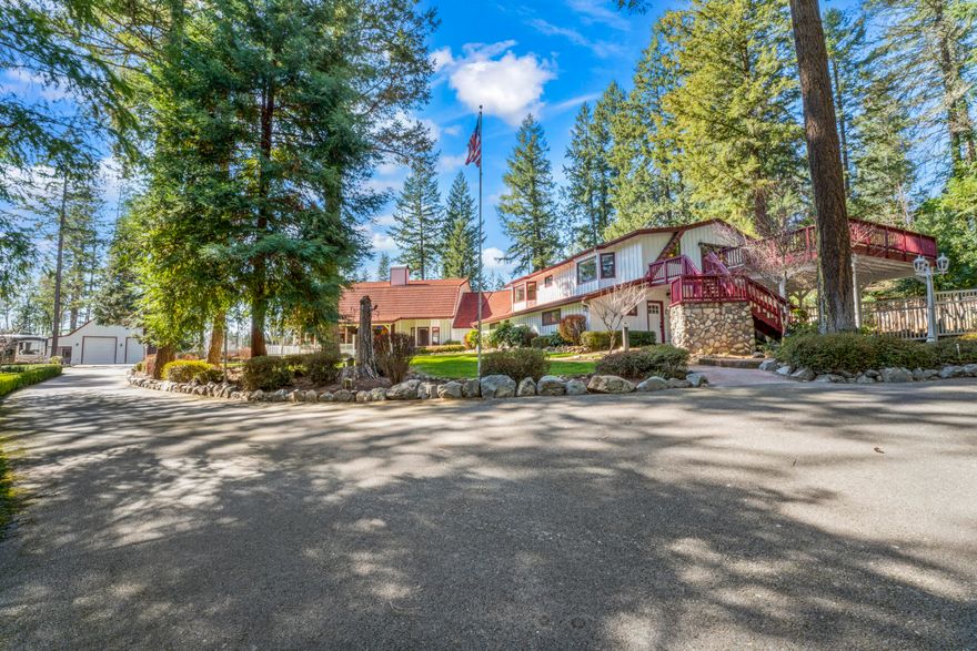 Wow, Wow and more wow! This outstanding, in the woods home has pasture for horses, farming, wedding setting and is a true two family setup in which easily an Air B n B.   All paved to the property and very expansive RV Garage for boats, toys and loft above for lots of storage.  Store everything in this building and you still have room!  Property is all fenced and gated for privacy.  Enjoy manicured landscaping where everything is in it's place with an entertainers dream.   Vaulted high ceilings, curves and design is all throughout. Family rooms, living rooms, guest bedrooms, two or 3 master suites, office, wine cellar, game room, two story rocked fireplace. You can have another family on one side with their own entrance as it's like having two houses under one roof or make this the grand house for a large family. views of the property from your patios, balconies.  This property was even featured in commercials. All photos and videos/tours are property of Hommati