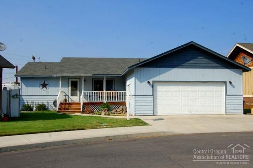 Well maintained, single level on Nelson! 3bd, 2ba, 1296sf built in 2003. Open floor plan with vaulted ceiling in living room, hickory cabinets, chair rails in dining room with slider to deck. Master separate from other bedrooms. Many updates including paint, flooring, bathroom fixtures and lighting. Nice fenced back yard plus separate fenced lot on side for RVs or shop with double access gate. Home has new Mitsubishi ductless heat unit with AC. Home in flood plain, seller has elevation certificate.