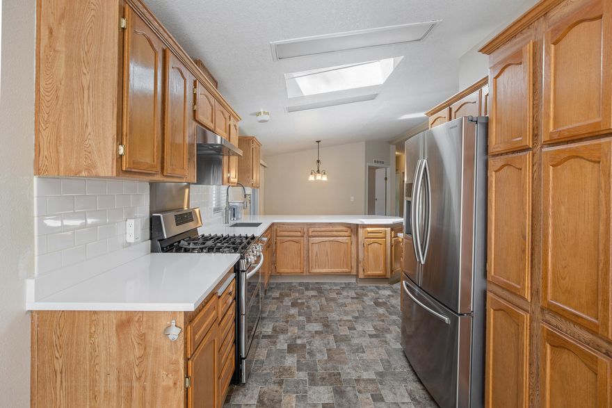 Immaculate and elegantly upgraded 3 bed, 2 bath home nestled in a serene, highly desirable park. A versatile bonus room with French doors offers the perfect office or den. Enjoy peace of mind with a 2-year-old electric heat pump and three premium Ring security devices, including a wired Doorbell Pro and dual Floodlight Cams. Propane-powered stove and a 27kW generator (model RX5C200A3, 6-12 months old) on dedicated LPG tanks—capable of powering the entire home. The chef's kitchen dazzles with quartz countertops, undermount sinks, double oven gas range, top-tier stainless appliances, roll-out pantry shelves, and designer faucets. Tasteful updates to interior/exterior paint, flooring, kitchen, and baths approx. 5 years ago. Relax on the newly installed Trex deck (3 months old) that connects seamlessly to a charming storage shed. Washer & dryer included—move-in ready perfection! financing available, seller will pay 3 months land lease with acceptable offer