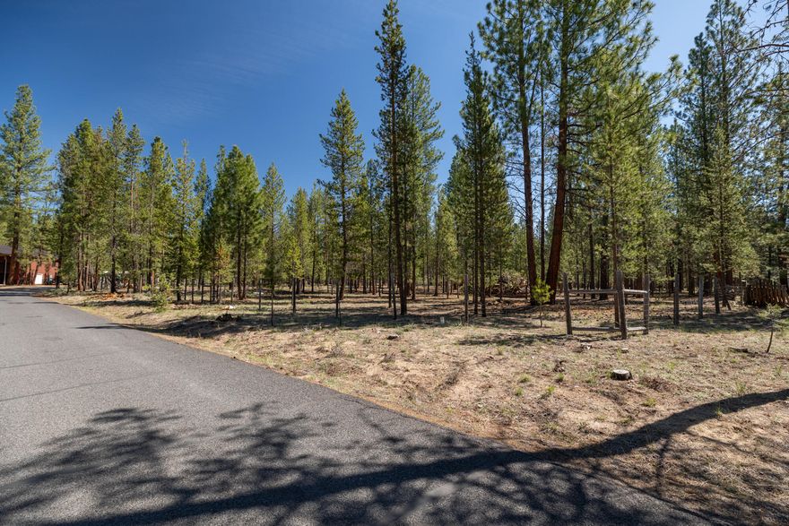 Lovely cleared lot with Ponderosa Pine trees, on a paved road located in Wagon Trail Ranch. Perimeter fencing and two access gates. This parcel is ready for your vision and building plans. Wagon Trail Ranch offers owners Little Deschutes River access, intimate clubhouse and heated pool in the summer months, hiking, and Wagon Trail Ranch has been awarded the firewise certification.