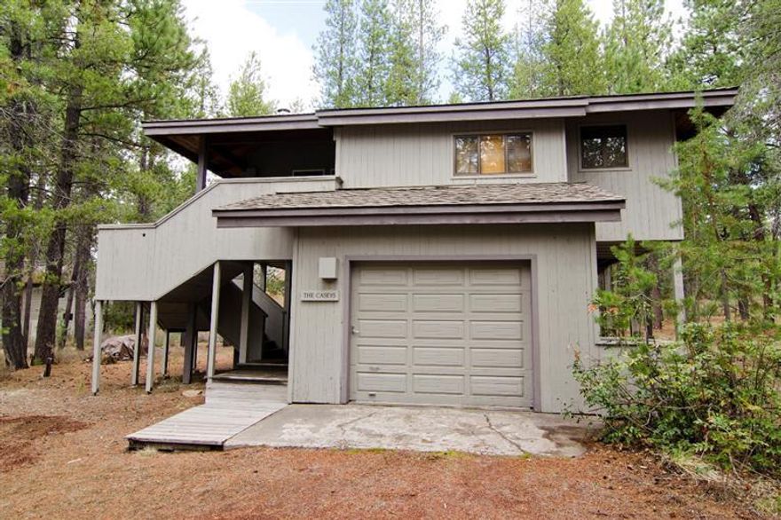 Cozy Sunriver cabin tucked in the trees! Loads of character in this cabin located near the Sunriver Village and the new aquatic center. Two story design with one bedroom/bath up and one bedroom/bath down. Cozy fireplace and a wood vaulted ceiling creates a cozy feel. Attached garage for your toys!