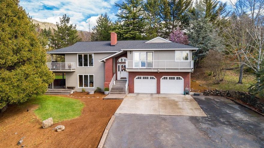 Sweeping views & quiet privacy are amongst the features of this beautiful 2016 remodel. Huge .72 ac lot nestled in the E Medford hills on a private drive. Newer hardwood floors, tongue & groove vaulted ceilings, paint inside/out, undermounted sinks, wood wrapped dbl pane windows, and other custom features throughout property. The island kitchen features slate finish appliances, quartz counters, stainless farmhouse sink, wine storage/fridge & large window for natural light. Main floor master suite continues the acacia wood floors, French door to balcony w/views of the valley, huge walk-in closet, dual vanity, quartz counters, soaking tub and oversized walk-in shower all w/brushed bronze fixtures. Expansive living room windows take advantage of the stunning views, wood burning fireplace & wall of built-in storage. Lower level has generous sized family room, exposed wood beams, more large windows & wall of built-ins. Seasonal creek, RV parking, oversized 2 car garage + attached shop.