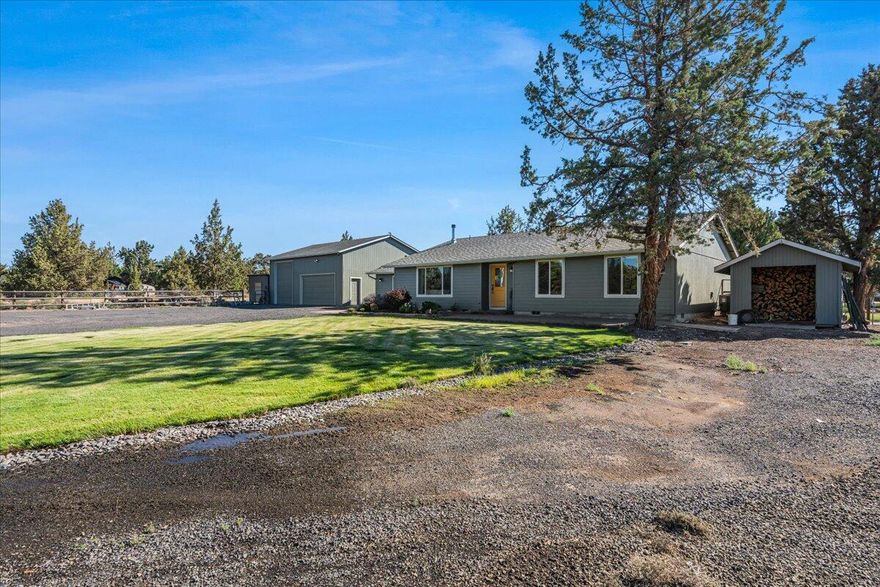 Enjoy Cascade Mountain views from this versatile 5-acre property in NW Redmond. With 3-bedrooms and 2 full-baths in the main home featuring wood laminate and carpet flooring, an open-concept layout, and large country kitchen with knotty alder cabinets and spacious center island. The converted 2-car garage now serves as a spacious family/rec-room—perfect for workouts, sports viewing, or movie nights.A generous covered rear patio has Smith Rock and pastoral views, a great place to watch the sunrise!  The additional studio/bunk house offers an extra sleeping area and bath great for overflow guests or a quiet home office space.  
Outbuildings include a 1080 sq. ft. shop, the 400+/- sq, ft studio/bunk house, and a small stable with three paddocks and a tack room—ideal for horses, 4-H or hobby farming. Fully fenced acreage also offers RV/boat parking, and nearby access to BLM and Deschutes River, perfect for riding and recreation.