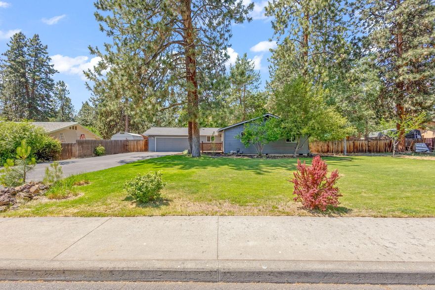 This updated single-family home blends comfort, practicality, and the stunning beauty of the Pacific Northwest. Nestled on a serene street with large lots and mature trees, the expansive 0.32-acre property provides ample outdoor space for recreation, gardening, and entertaining. A spacious driveway leads to an attached two-car garage, additional RV parking, and a storage shed, ensuring plenty of room for vehicles and storage. Whether you're looking for a peaceful retreat or a home that perfectly balances convenience and comfort. Enjoy close proximity to the Old Mill District, with its vibrant shops and restaurants, as well as easy access to Mt. Bachelor and the Cascade Lakes, making it a dream location for outdoor enthusiasts.