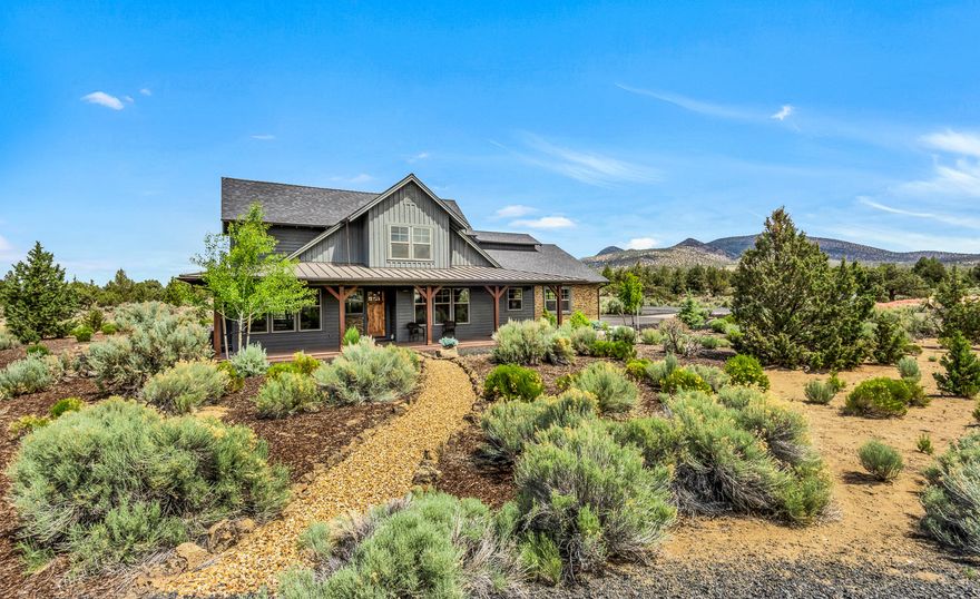 Gorgeous lightly lived-in home that shows like new construction! Featuring stunning wide-plank hardwood floors & solid alder trim/door package throughout! Outstanding chef's kitchen boasts double islands, slab granite counters and professional line Kitchen Aid appliances! Warm & inviting great room with stone fireplace. Huge main-level master suite features his & hers walk-in closets, spa-like master bathroom with walk-in tiled shower, dual vanities & huge soaking tub. Add'l main level bedroom and/or office has a custom built-in murphy bed & desk for versatile usage. Upstairs opens to a spacious loft/bonus living area with Cascade Mountain views, two additional large bedrooms & enormous bathroom with dual vanities. Relax and/or entertain in the back yard under a covered patio with views of Powell Butte & extensive adjoining HOA acreage for endless privacy. Oversized 3-car garage includes workshop cabinets & tankless hot water heater. Home qualifies for nightly vacation rental option