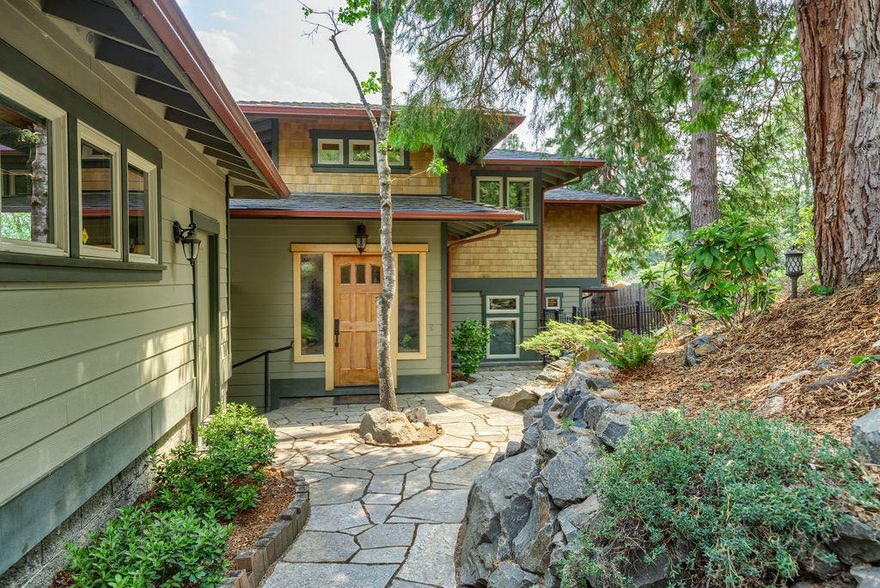 Exquisite home, hand crafted w/ quality materials, design & finishing touches. Every attention to detail; custom Cherry cabinets with pull outs, incredible wood work, built-ins, and alcoves. Well appointed kitchen with butcher block and island, downdraft range, stainless appliances and granite counters. Vertical grain bamboo flooring. Slate entry and bathroom floors including a radiant heated master bathroom floor w/ soothing corner tub, extensively tiled travertine shower, custom dual vanity and huge closet. This home offers privacy, designated office space w/ French Doors to a courtyard, views, great light amid warm colors for an easy lifestyle, a stone's throw to Lithia Park and the Plaza. Main level owners suite + guest rooms and bonus loft area upstairs. Nice separation of space. Expansive decks are great for outdoor entertaining. Two car garage plus ample off street parking. It shows pride of workmanship and the creativity of the builder.