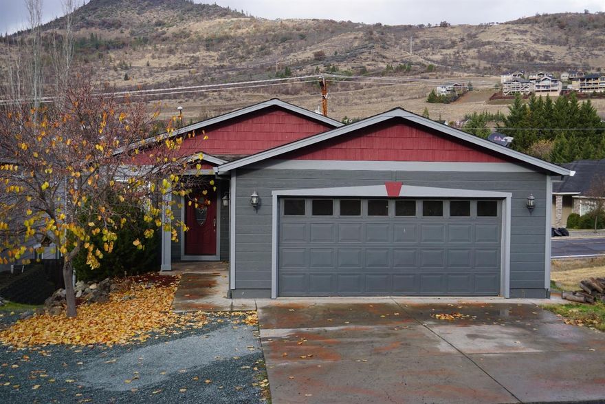 4 bedroom, 2.5 bath with views of Roxy Ann Mountain! Located in a very nice East Medford neighborhood on a .14 acre lot. Vaulted, open floor plan, light and bright living room with a corner gas stove. Kitchen has granite counter tops a large island and leads to a covered balcony just perfect for your BBQing. Nice master bath with jetted tub, dual sinks and neutral colored tile. Master bedroom features coffered ceilings and a walk-in closet. There is a surplus of storage. Upstairs laundry room with large window. Downstairs there are 2 bedrooms, a spacious bonus/family room with private access to the large, fenced backyard with fire pit. Exterior of home was painted just 2 years ago. This description covers just some of the features that make this home worth a tour!