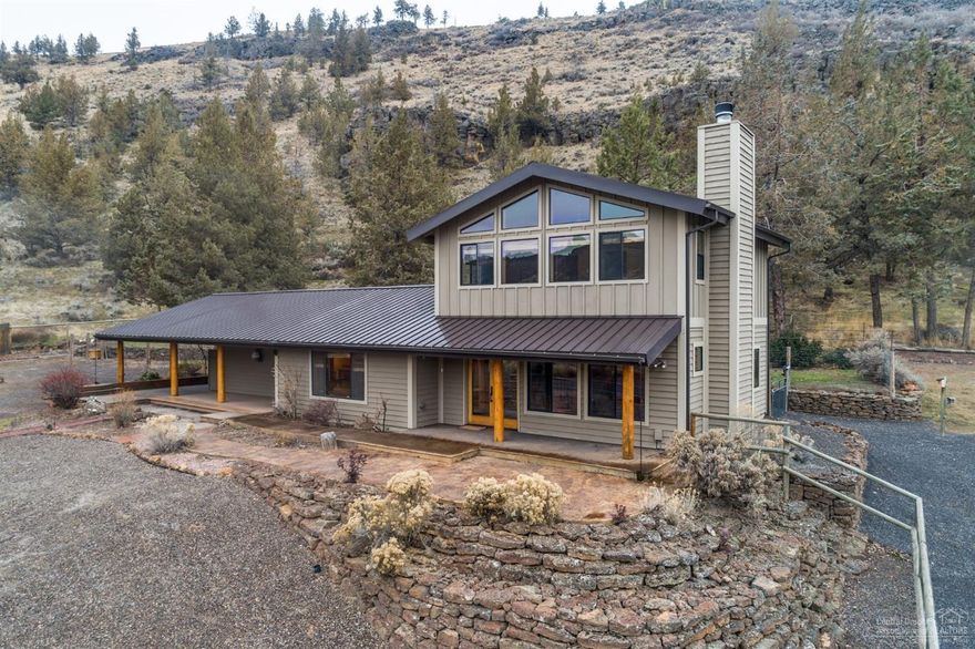 A paver walk leads you to this stunning Northwest style home w/tongue &amp; groove wood ceilings &amp; walls, tile floors w/radiant heat &amp; wood plank flooring. Propane FP puts out a surprising amount of heat &amp; family room has wood-burning stone FP w/Juniper mantel that will knock-your-socks-off! Under stair wood storage means you won't track up your beautiful wood floors w/debris! Large dbl doors open to a covered, stamped-concrete patio. The master en-suite is to die for, w/picture windows that open to an unsurpassed view of the Crooked River Canyon, as a plethora of color dances across the rock walls! The 4th bdrm is large &amp; makes the perfect den, office or hobby room, w/exterior door. Home is hot tub ready, on a secluded &amp; private covered patio. Backyard is completely fenced for critters or garden. The oversize dbl garage has insulated &amp; heated office . To top this off is the 720 SF insulated shop, w/mezzanine storage, concrete flrs &amp; power, plus 50-amp RV ho