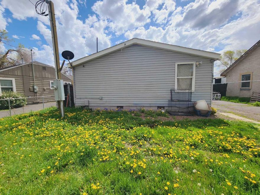 NO CC&R or HOA, manufactured home on owned land, perfect investment property with this open concept 1500 sqft manufactured home. Specious rooms and a smart floorplan. Double vanity in the master bathroom, tile shower, built- in storage and walk- in closet. Kitchen with gas range, garbage disposal, dishwasher & walk-in pantry. Separate laundry room with access to backyard. Extra-long driveway for parking. Detached single garage has cement floors & electricity. Located near bus lines, grocery stores and schools, with easy access to everything. Great for an investor or first-time home buyer! Sellers preferred lender is offering  free / buydown and no lender fees on first refinance. All appliances stay.