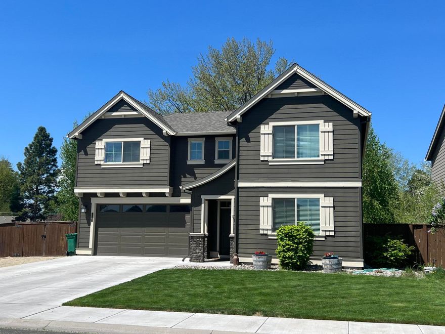 Newer built custom home in a great neighborhood. Featuring 4 large bedrooms, 2.5 baths, and 2,300 soft. Open floor plan with nice entryway, beautiful kitchen with quartz counters, oversized breakfast bar with seating, stainless appliances and dark wood cabinetry. Living room features a cozy gas fireplace and large slider that leads to the concrete patio and large fenced back yard. The 4th bedroom could also serve as a bonus/family room. Nice primary suite with double sink vanity, oversize step in shower, walk-in closet, and separate toilet closet. The garage is extra deep with great storage and space for extra toys. This home is still like new and move in ready condition!