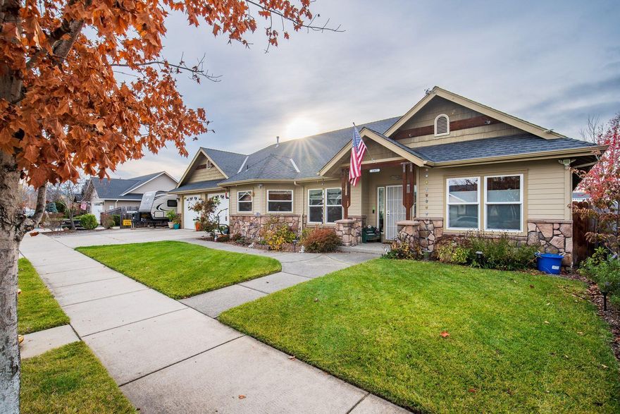 A cozy home with character!  This 2007 Northridge built home is single level and 1838sf, with 3 bedrooms and 2 bathrooms.  Welcome into an open concept living space with vaulted ceilings, hardwood floors, and a gas fireplace.  A gourmet kitchen fit for a chef boasts granite slab countertops, a gas stove, cherry cabinetry providing tons of storage.  Comfortable primary bedroom also has vaulted ceilings along with designer window blinds, and a barn door leading to en-suite bathroom with double vanity, jetted tub, and large walk-in closet.  Head outside for more great details such as a concrete patio perfect for entertaining, hot tub, and double car garage with shop space.  RV parking with full hookups.  Great curb appeal with over 150 tulips blooming in the spring!  Close to hospitals, shopping, and restaurants.  Be sure to add this one to your holiday list!