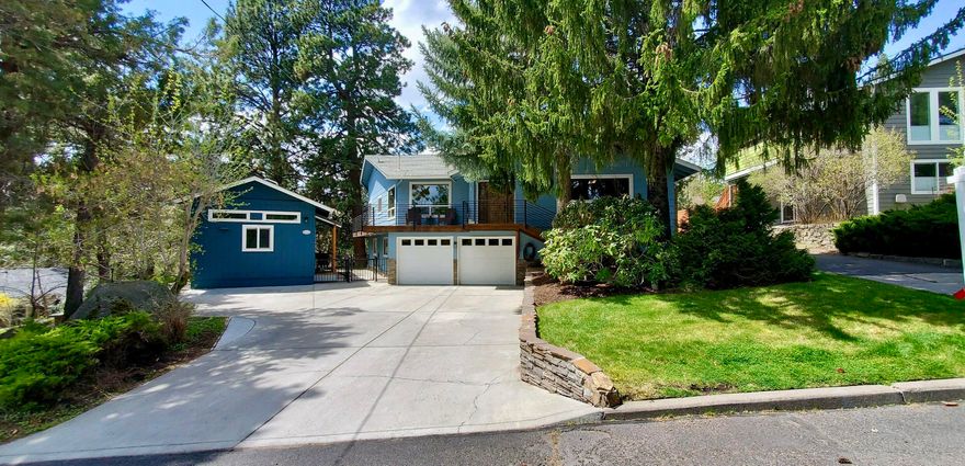 Nestled amongst the pine trees in NW Bend on a 0.27-acre lot, this property offers the perfect blend of natural beauty, tranquility, and convenience. Close to downtown, parks, hiking trails, and everything Bend has to offer. The home's Sq ft includes a darling 392 sq ft permitted ADU, featuring 1 bedroom, 1 bath, kitchen and great room w/fireplace.
Inside the house you'll find a spacious living area with two fireplaces, a large wrap-around deck, and plenty of room to spread out in the summer. With 3 bedrooms plus an office, a finished basement with bonus/flex space, there's plenty of space for relaxation and entertainment. The home boasts beautiful oak floors, granite countertops, and stainless-steel appliances, including double ovens, a 2-3 car garage, and much, much more!

Outside, you'll love the beautiful landscaping and large RV parking area.  Whether you're looking for additional income or multi-generational living, this is an excellent opportunity.