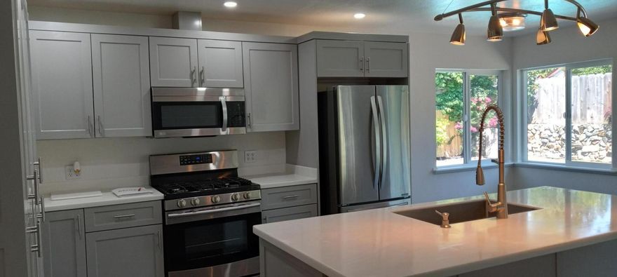 **SELLER WILL CARRY AT 5 %  interest**
ALMOST BRAND NEW!!! Complete remodel and renovation! BEAUTIFUL Mid-Century/Modern & spacious home tastefully designed and detailed. Gorgeous new bright kitchen with large island/breakfast bar, upscale appliances, custom built-in pantry cabinets, cozy dinette all open to large family room/dining room combination with huge open beam and slider to the pool & outdoor dining. New laminate wood flooring & carpet. Oversized living room, has brick gas fireplace. 4 spacious bedrooms, primary bedroom has walk-in closet, & sliding doors to the pool and patio. All new modern bathroom fixtures, & cabinets. Beautiful and inviting inground pool with new heating system. Large patio area perfect for entertaining. Rock waterfall feature and pond with koi fish. Fenced landscaped yard with sprinklers, and pretty open views! Space for RV, 100 yr. metal roof! 
Close to the Rogue River and Historic Old Town Grants Pass . SELLER MOTIVATED!  BRING YOUR OFFER!
MUST SEE!!