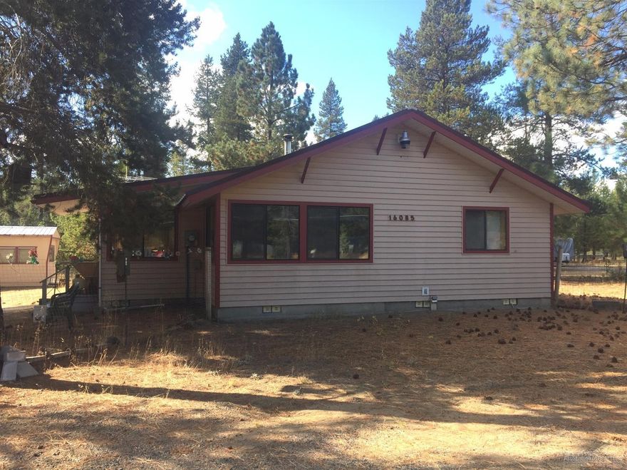 Lots of square footage for the money. . Includes a huge insulated, heated & finished porch. An older single wide also included, used as a shop. 2 large bedrooms and 2 baths. Also includes a water softener. All permits are available.