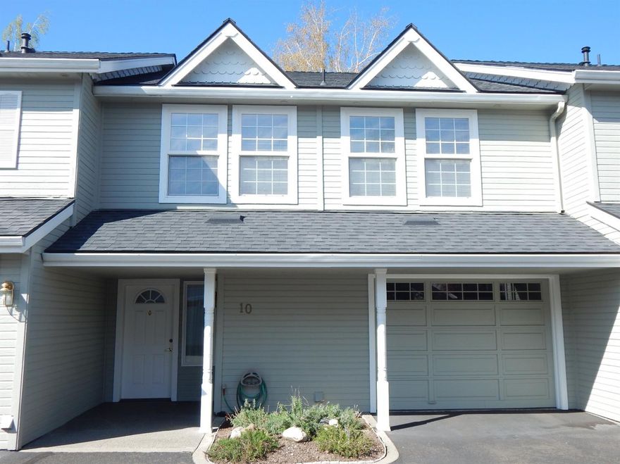 Highly desirable townhome in well maintained Eastridge Village! Bright and cheery living area on the upper level with vaulted ceiling, cozy gas fireplace, and views of the surrounding mountains. Spacious kitchen with oak cabinets, pantry and breakfast bar. Newer range, microwave and refrigerator included. Huge Master bedroom and bathroom with walk-in closet. Lower level has a tiled entry with utility room. Two large bedrooms and full bath. Attached one-car garage with an assigned space close by. New roof! HOA fees of $195/month include manicured landscaping, in-ground pool, clubhouse, water and sewer. Home is super clean and move-in ready. One year Home Warranty is included by Fidelity National.