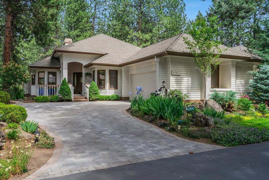 Your dream home in the desirable gated community of Mountain High is here! Nestled on a private lot with elevated views of the golf course and surrounding trees, this beautifully renovated 3-bedroom, 2-bathroom home offers both comfort and elegance. Step inside to discover real hardwood floors, brand-new carpet, and an abundance of natural light throughout. The open layout features two inviting living areas separated by a double-sided fireplace, perfect for entertaining or cozy nights in. The kitchen boasts a stylish tile backsplash, solid surface countertops, ample storage space, and stainless steel appliances. The spacious primary suite is a true retreat with large windows, private access to the  back deck, a soaking tub, walk-in shower, and a walk-in closet. A large two-car garage offers ample storage space. Enjoy resort-style amenities in this community, including a swimming pool, tennis and pickleball courts, a picnic area, and scenic walking paths. Schedule a tour today!