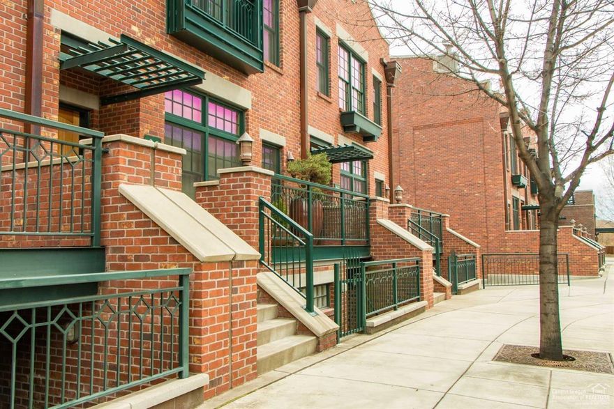A rare opportunity to live in the exclusive Mill Quarter in downtown Bend! Stunning brownstone townhome a short walk from town, the Old Mill district, and the Deschutes River! Exceptional architectural design, rooftop garden with Cascade Mountain views, separate suite with private entry to be used for office, guest quarters. Stainless kitchen with Viking appliances, elevator for easy access up and down. No HOAs! Oversized two car garage, ample guest parking. An urban lifestyle in the heart of Bend.
