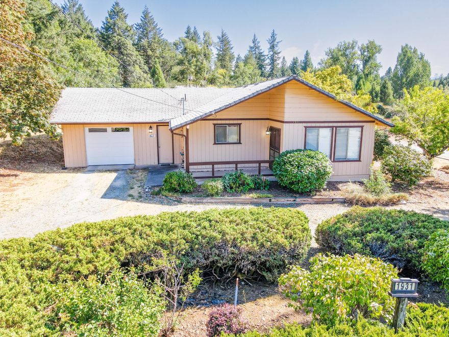 Vintage charm with all of the modern amenities including updated HVAC on a large 0.24 acre lot with mature landscaping! This single level 1,176 SF home 2 bedroom, 1.5 bath home is located in a great area close to town. Everything here is very clean and livable, but there is also the opportunity to update it to your own taste! The floorplan is open and thoughtfully laid out. Outside, you will find a circle drive, a private backyard, and an inviting covered entryway. There is also an oversized 1 car garage with an updated door with room for all your toys. There is nothing to do but move in! This property is just minutes from shopping, schools, Fruitdale Park, and the Rogue River! Call for your tour today!