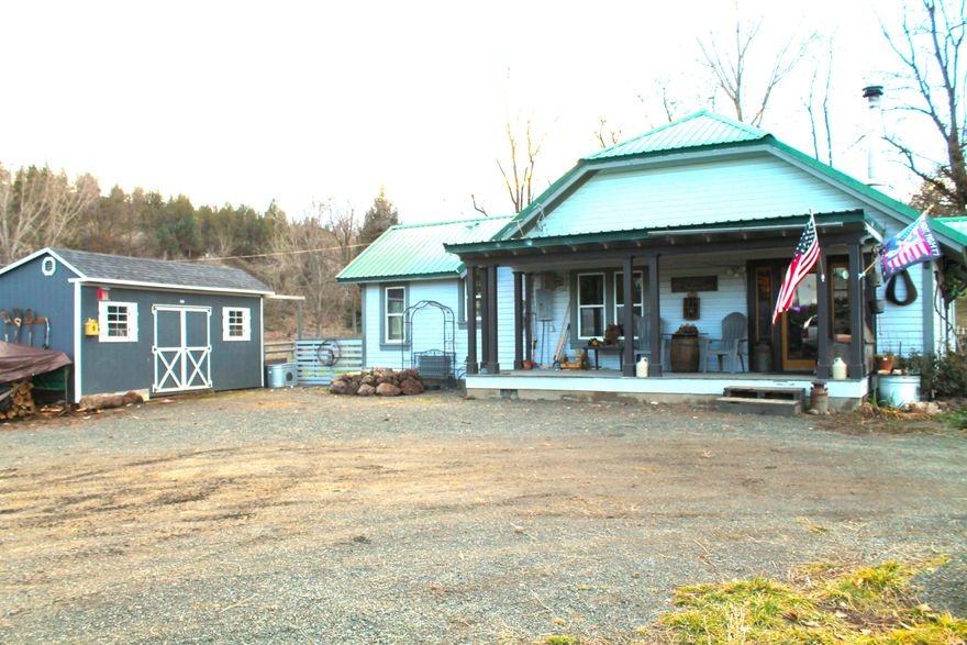 8.28-acre Hobby Farm with picturesque setting nestled just outside of the little quaint town of Dayville. The home is surrounded by towering mature trees, apple trees, pear trees, a cherry tree and a large stretch of grapes vines. There are multiple outbuildings, including a 20x30 Quonset hut car cover, 14x24 workshop with bench, large tack room/chicken coop, Pumphouse, Root cellar, 3 12x12 and 2 10x10 Shelter logic that are attached to the heavy-duty fence panels. The property is fenced and cross fenced with a large, irrigated pasture for your animals. The house is a charming rustic modern farmhouse with 3 bedrooms and 1 bathroom. There have been many updates including a new woodstove, flooring, natural wood finishes and appliances. This home has warmth and simplicity. Sit back on your large covered front porch and enjoy the luxury and human way of life this place has to offer. VA Financeable and assumable