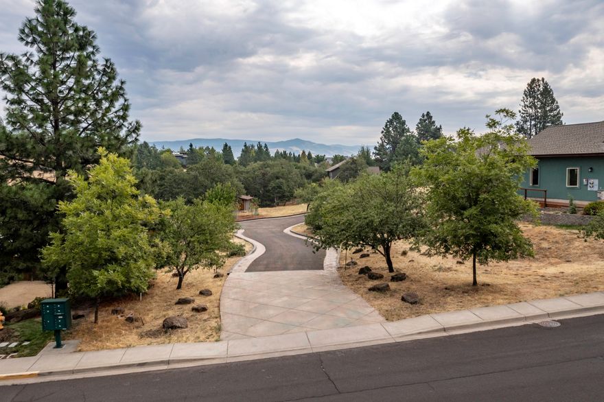 One of Ashland's most desirable areas. Gorgeous mountain and forest views, quiet and peaceful in area of upscale homes. This beautiful lot located on Westwood is .83 of an acre with expansive open areas. Paved entry leads to this sunny parcel with producing fruit and nut trees, bring your own cheese! This is a wonderful place to call home, just at the edge of the forest and with multiple trails nearby. City water and sewer plus the property has its own well and one car garage for shop/storage. Call broker for site information.