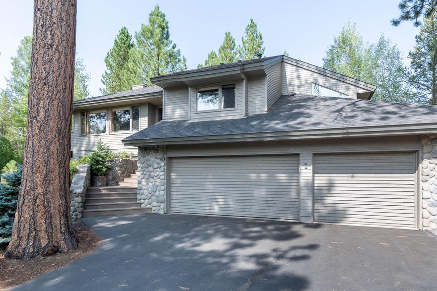 First time on the market! This custom-built BEAUTY is updated and lovingly maintained by these original owners. Vaulted pine accented ceilings greet you on the main floor. The great room has a definite Sunriver flavor with the floor to ceiling river rock surround gas fireplace for those cool evenings!  Hardwood flooring in the dining area through the open kitchen area. Quartz counters, great custom cabinetry, large granite island with eating bar, stainless appliances, and deep farm sink. Spacious primary suite with updated bath, soaking tub, custom tile shower and heated tile floors. Guest bed & full bath complete the upper level. Downstairs you will find a perfectly appointed family room w/ woodstove for an extra area to entertain. Two guest bedrooms & full bath with large vanity & tub/shower combo. The laundry room w/ deep utility sink is off the 3-Car garage. Large deck area & hot tub w/ views of the National Forest. Landscaped. SHARC Paid. Don't MISS this one!