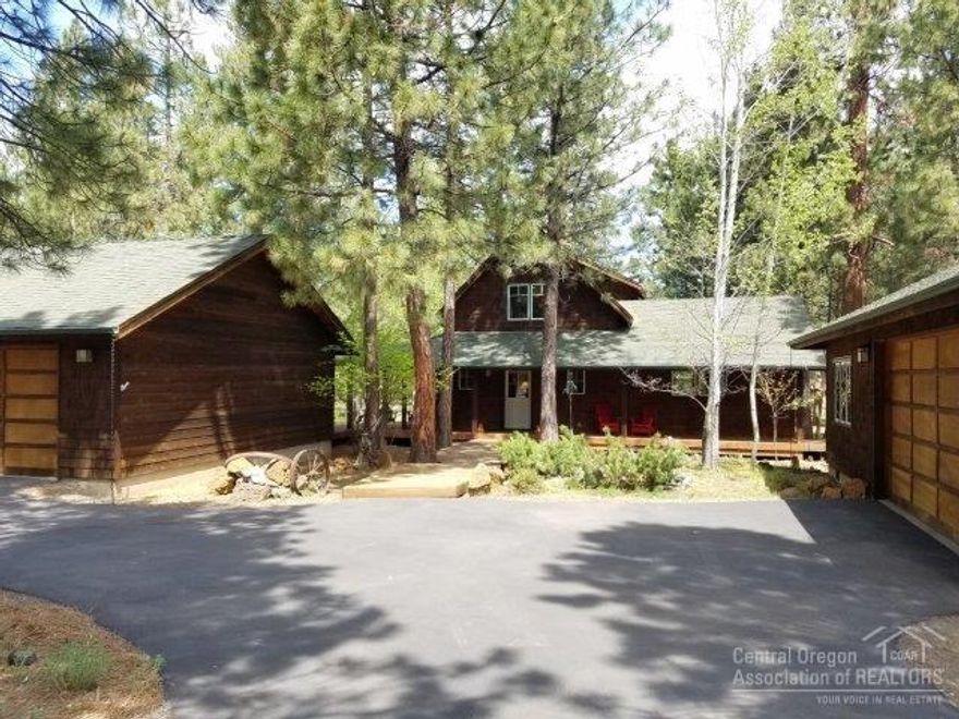A very special home in the pines. 3 BR's, 2 BA's, 1777 sf w/dbl garage plus detached studio/shop/garage with full bath. Quality construction filled with character and charm. A paved circular drive leads to the courtyard entry and covered porch. Great room living with hardwood floors, river rock gas fireplace and open beams. Solid wood windows, doors and trim. Cedar boardwalks and decking overlooks simply landscaped 1 acre homesite. Located in Crossroads, a wonderful forested community just west of Sisters.