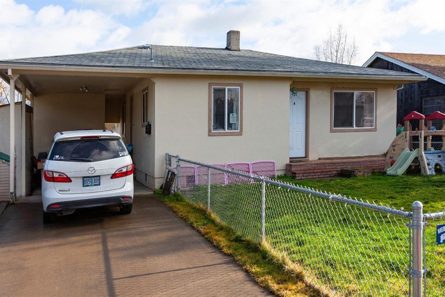 Two Dwelling Units On One Lot. Income Producing - Investment Property. Unit (A) 2 bedroom, 1 bath, 808' sqft, currently rented for $775/month. Unit (B) 1 bedroom, 1 bath, 480' sqft, currently rented for $700/month. Good rental history with long term tenants. Each home has a separate/private entrance & nice fenced yard, carport, secure outside storage, natural gas/forced air heat and central air conditioning. Convenient West Medford location close to Jackson Elementary. The neighborhood has a good mix of home ownership & rental homes. Call for additional information & showing instructions.