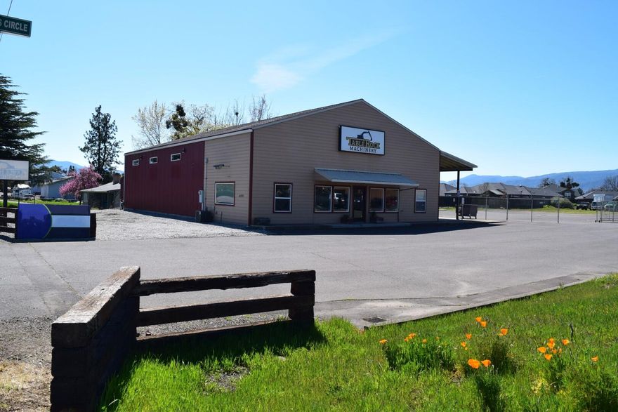 Class A multi-use commercial building on LAND! Prime location 1 mile from I-5 exit at Central Point & Pilot Travel Center, this area is rapidly developing near Amazon's new distribution center, Costco, retail centers, airport, & several freight terminals including FedEx. The property is perfectly laid out on 1.52 acres with a huge mostly fenced & gated yard space with drive-through entrance & exit. The 4,000 sf bldg has a beautiful showroom with stained concrete flooring & 3 bay heated shop space. The 3 phase, 220 finished & insulated shop is free span & extraordinarily well maintained. It has automatic overhead doors, extra shop lighting, & additional exterior work space on a concrete slab & covered awning. There is ample paved parking & excellent roadside signage with high visibility & traffic count. Outdoor retail display area & monument sign have street frontage advertising. The property is across from Pape Machinery in a popular commercial district of Medford & Central Point.