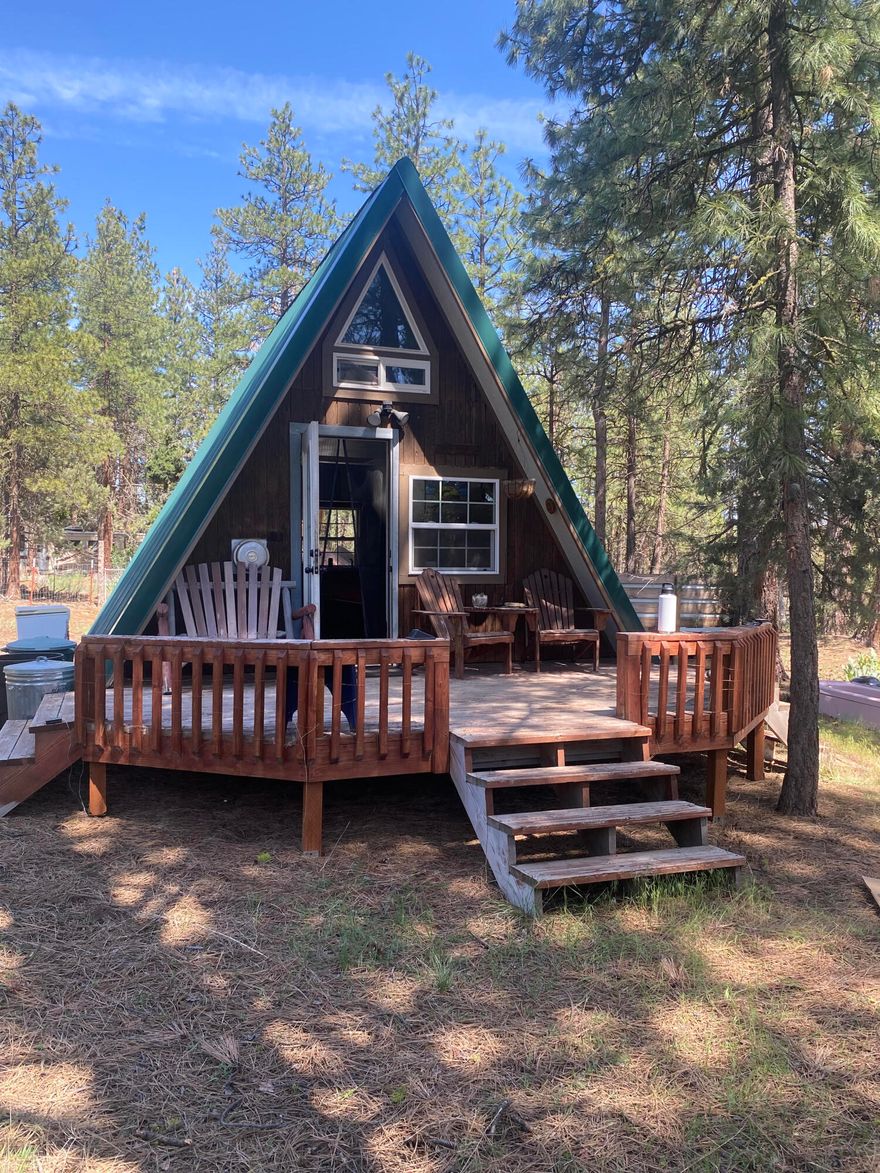 RETREAT ! cabin in the woods on 2.34 acres. 
Super cute A- frame. Propane heat, kitchenette with propane range.
Enjoy the deck peace and quiet. 
The property is completely fenced, gated and has a storage shed. 
This property has septic approval.