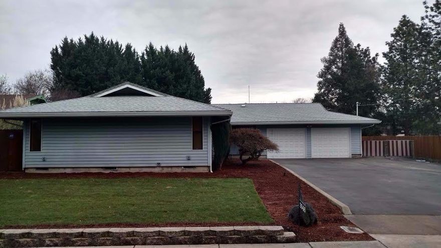 Excellent 2451 sq. ft. family home with 4 bedrooms, 3 bathrooms and a den all on almost acre lot (.44 acre) There is a 2 car attached garage, RV parking, carport, an additional 2 car garage with large shop. This home features 4 bedrooms, family room, see thru wood burning fireplace, gas fireplace, spacious bedrooms with built-ins. The kitchen is bright and has abundant cabinets and counter space. There is a huge living room with floor to ceiling brick fireplace with a huge window that looks over the backyard and huge pool with diving board. The back of the home has a huge game room/ den with wet bar and windows that allow natural light to flow. This home is close to the Rogue Valley hospital, Hoover school & shopping.