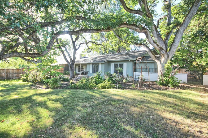 Old East Medford Location & Charm! This home offers timeless vintage character. Set on a spacious lot w/ a large, private front yard offering a pleasant, covered patio for peaceful relaxation looking over mature trees & landscaping. Step inside to a wide entryway leading into a light-filled living room featuring a tiled fireplace & built-in bookcases. The dining room is also light filled w/ sliding glass doors & windows to the large covered back patio. The kitchen includes a cozy breakfast nook, built-in workspace & ample cabinetry. 2 master bedrooms w/ bathrooms & walk-in closets & a 3rd bedroom providing ample space & unique character. An attached 2 car garage is backed by a bonus room w/ its own private entrance, full bath. Perfect studio or office w/ a full wall of built-in shelving & a full wall of windows for a light inspired feel. Seller is Oregon Licensed Realtor.