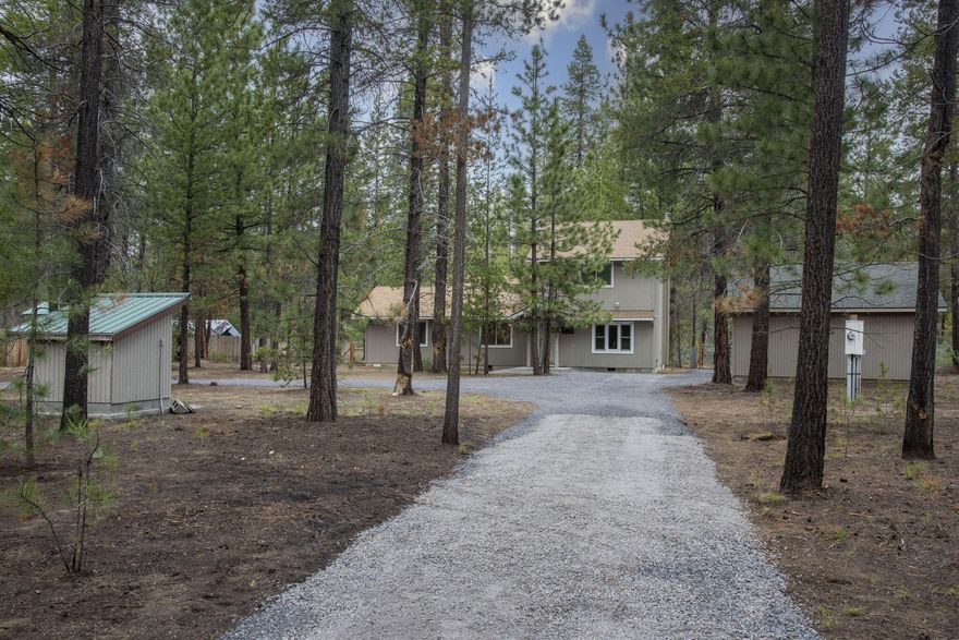 60K Price Adjustment!!! This home is a must see - a cabin in the woods that backs directly to La Pine State Park. The perfect cozy home on a private, level acre, with real hardwood floors, three nice sized bedrooms, primary bedroom on the main level plus kitchen with granite tile countertops. Open dining/living area and bonus family room with wood burning fireplace provides space for everyone to relax and enjoy this special setting. Enjoy peace and quiet from your back porch with your morning coffee, go for a hike on a nearby trail, or head over to the Deschutes River for some fly fishing. Sunriver is just 15 minutes north, La Pine to the south and 30 minutes to Bend. Amenities and outdoor recreation abound - minutes to Quail Run golf course, Mt. Bachelor resort, Paulina Lake, Newberry Crater and more. This home also offers a two car garage, circular driveway and RV/trailer parking. Bring all your toys! Enjoy serenity and all the nearby amenities from this very lightly lived in home.